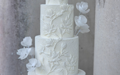 Textured magnolia 4 tier wedding cake featuring abstract roses - Stansted Park