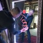 A guest at a Corporate Event signing the Mirror